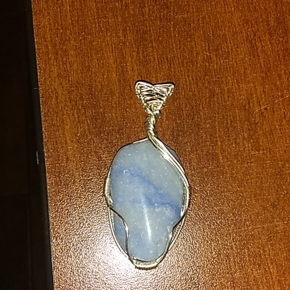 Wire wrapped stone.